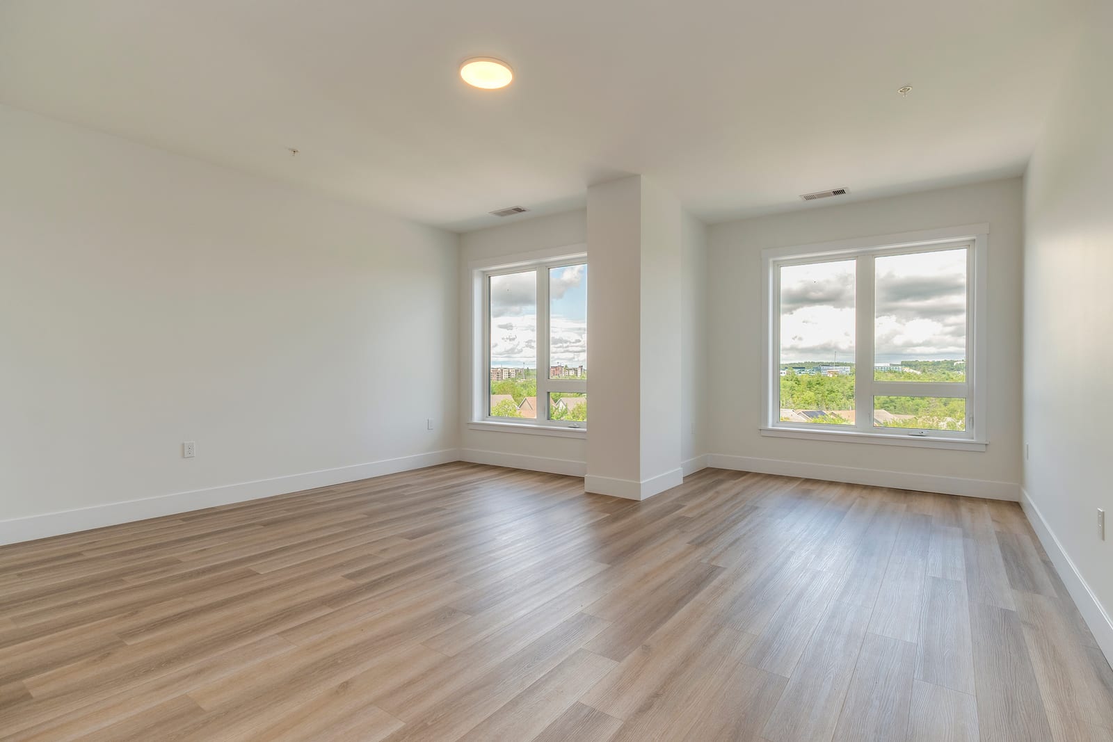 Bedroom with two large windows and plenty of natural light
